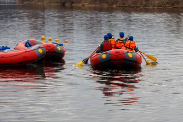 Guys in the boat perform the task of the instructor.