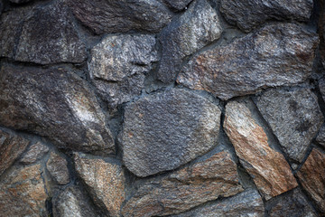Masonry texture. Background of stones. Part of the wall. The design of the fence. Rough rough stone. Blank for the design of the fence.