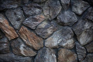 Masonry texture. Background of stones. Part of the wall. The design of the fence. Rough rough stone. Blank for the design of the fence.