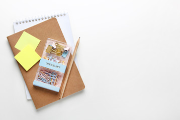 Flat lay composition of notebooks, pencil, binders.Copy space,white background.Top view on various stationery on desk. Creative workspace background.Back to school concept