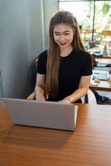 Beautiful Attractive Asian woman working with computer laptop and thinking to get ideas and requirement in Business startup feeling so happiness,Business Startup Concept