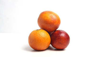 a pile of citrus fruits isolated on white background