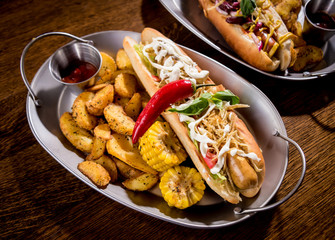 Hotdogs and French fries on a dishes. Fast food meal. Restaurant.