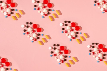 abstract background with pills pattern on pink