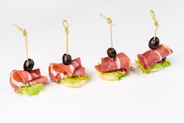 Snack canapes to the buffet on a white background