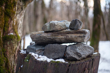 The stones are stacked on top of each other. Meditative experience in laying stones. A figure in a rock garden. Composition of rock. Natural background calm and harmony from natural materials.
