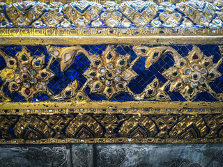 color glasses decorating details from pieces of ceramic on pagoda wall in wat phra kaew the temple of the emerald buddha bangkok thailand