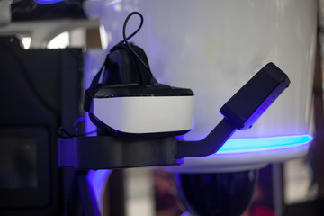 A device for immersion in virtual reality. Modern technology in action. Futuristic amusement park. A gaming machine for the full sensation of virtual reality. Future design.