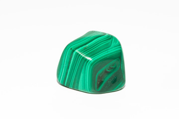 A sample of the mineral malachite on a white background