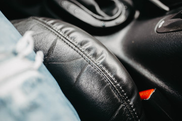 leather black interior of a luxury car. handmade leather upholstery