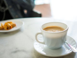 Hot coffee close up on table in cafe