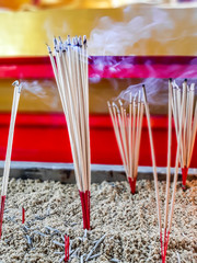 Close up burning incense sticks and smoke from incense burning.Incense to worship what respect..