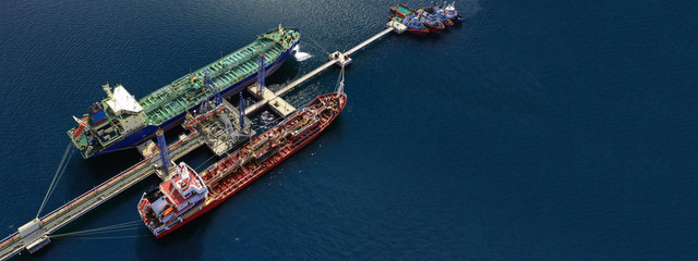 Aerial drone ultra wide photo of industrial fuel and gas tanker ship docked in Mediterranean port...