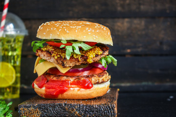 burger, meat cutlet beef steak, tomato, sauce and lettuce tasty meat snack sandwich menu concept. food background. top view. copy space