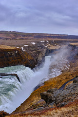 Fototapeta na wymiar The beautiful and fast flowing GullFoss Waterfall on Southern Iceland formed by the Hvita River