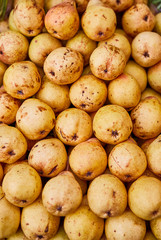 Pears lie on a counter in a store top view