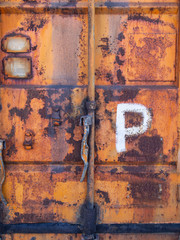rusty old orange metal door