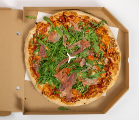 Pizza with Tomatoes, Prosciutto, Arugula and Mozzarella