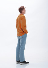 Fototapeta premium rear view. casual young woman looking at white wall