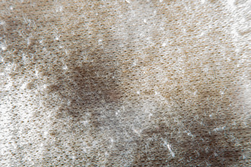 Blurred at high magnification background with bright fabric. Close-up of knitted threads.