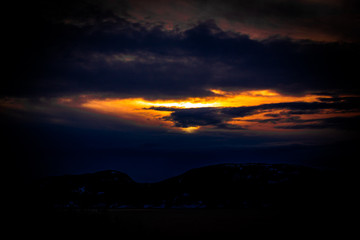 Fototapeta na wymiar Som dramatic light over the fjord in Trondheim Norway. maybe it is E.T. coming for a visit?