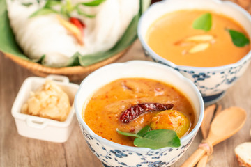 Passionate of Siam cuisine concept : set of spicy fresh noodle with red curry soup 