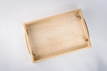 A empty wooden box on white background, top view.
