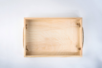 A empty wooden box on white background, top view.