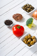 mediterranean food ingredients on white wooden