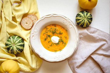 Bowl of pumpkin soup on white background. Healthy food.