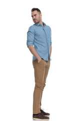 Fototapeta premium Side view of bothered casual man frowning