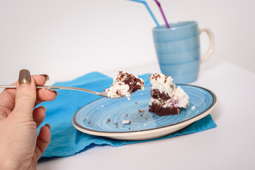Homemade chocolate cake. Sweet chocolate cake on blue plate.