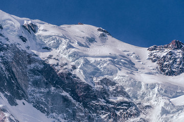 Monte Rosa, one of the most famous peaks of all the Alps, during a beautiful winter day, near the town of Macugnaga, Italy - March 2020.