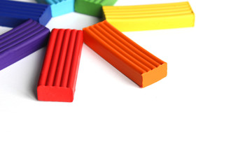 multi-colored plasticine on a white background. Educational games for children