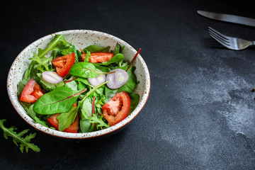 healthy salad tomato, mix leaves, onions and other ingredients, vegan, keto or paleo menu concept....