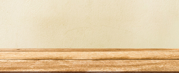 closeup building exterior tan color  retro cement wall background texture with old wood perspective counter for show,ads,design product on display concept