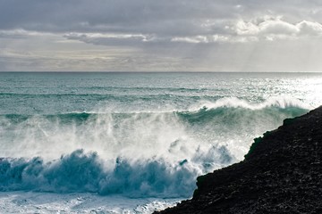 waves crashing on rocks