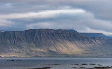 Landscape of westfjord with cloudy sky - Iceland.