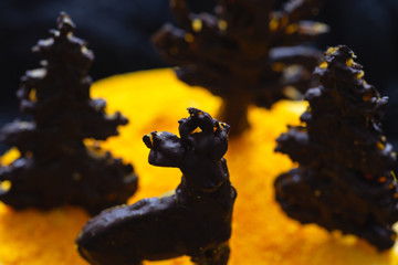 Close up of a fresh orange powder on a cake with chocolate decoration. Vegan cake. Healthy food.