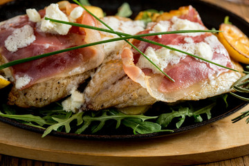 Sea bream stuffed with cream cheese and smoked ham with young potatoes and leek