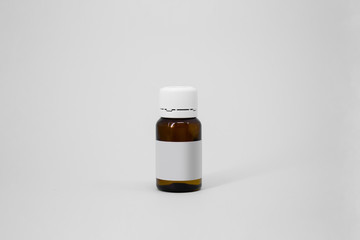 Medical glass Bottle. Medicine bottle of brown glass with white cap isolated on white background. Mock up.