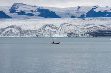 Small boat Floating in Jokulsarlon glacier lagoon, Iceland
