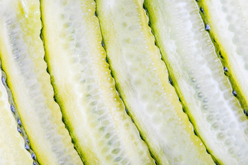 backgrund of slices of picled cucumber, wallpaper, closeup, macrophotography