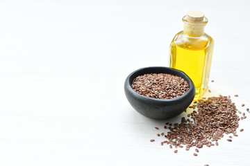 Flaxseed or flaxseed seeds, accompanied by oil (Linum usitatissimum) displayed in containers