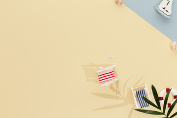 Holidays Travel. Sun lounger shell sailboat summer background with copy space for your text. Flat lay, top view.