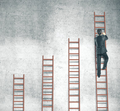 Businessman Climbing On Ladder