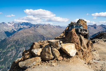 Car in mountains and peaks landscape in the background. Hills covered with glaciers and snow, natural environment. Hiking in the Gaislach. Ski resort in Tirol alps, Austria, Europe