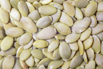 background of pumpkin seeds, closeup, macrophotography