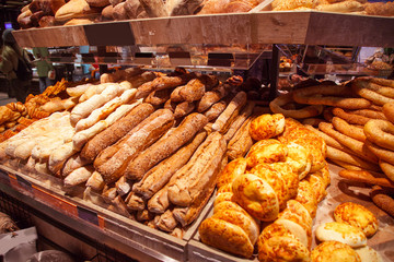 Shop with bread. A large shelf with buns is for sale