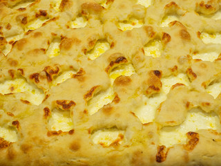 Delicious Italian pizza cooked in the wood oven with different kind of melted cheese